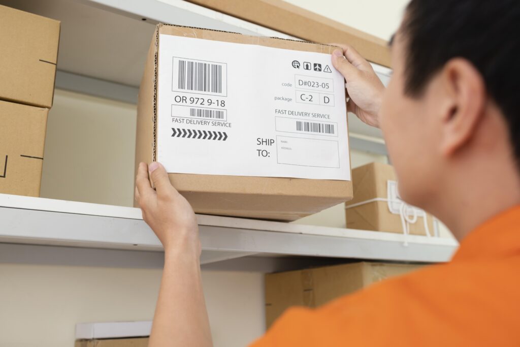 Man taking barcode box off shelf